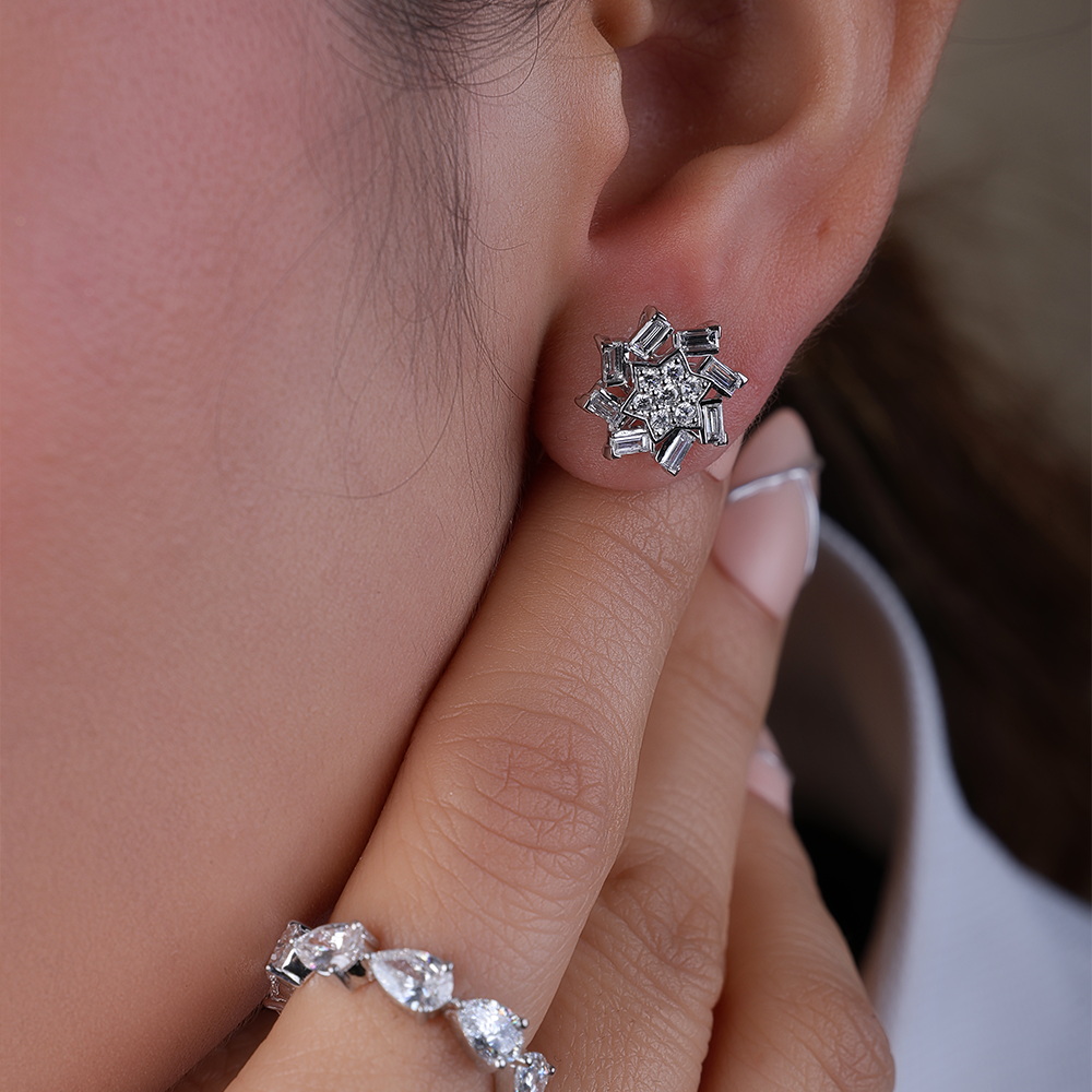 Snowflake-inspired stud earrings with baguette and round Diamonds